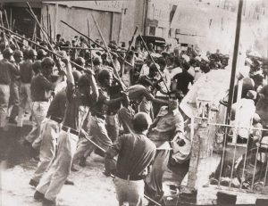 police charging batons on protesters during the movement for restoration of democracy MRD in August 1983